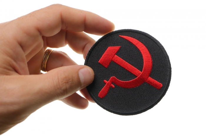 Hammer and Sickle Iron on Novelty Patch shown on hand for size comparison
