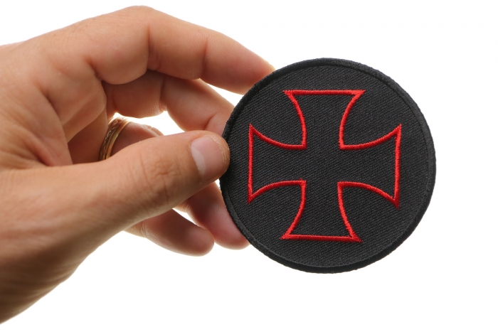 Iron Cross Novelty Patch Red Black shown on hand for size comparison