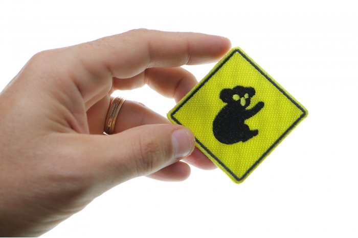 Koala Sign Iron On Patch shown on hand for size comparison