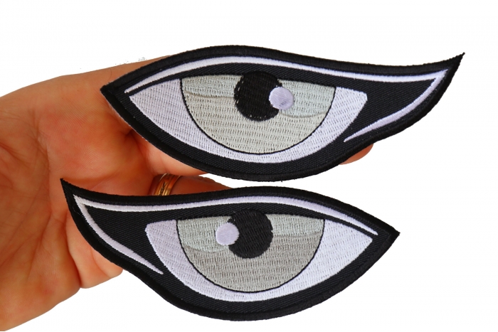 Medium Silver Eyes Iron on Patch shown on hand for size comparison