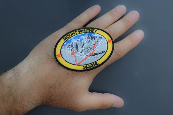 Mount Whitney Patch shown on hand for size comparison