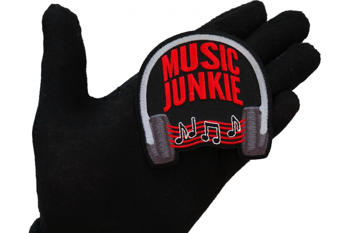 Music Junkie Patch shown on hand for size comparison
