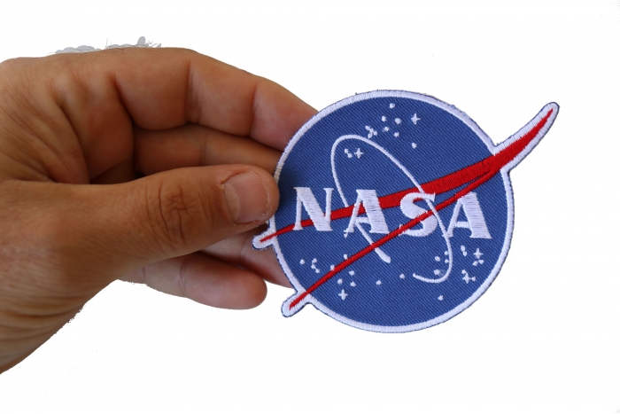 NASA logo Novelty Iron on Patch shown on hand for size comparison