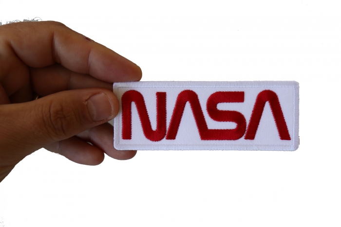 NASA Novelty Iron on Patch shown on hand for size comparison
