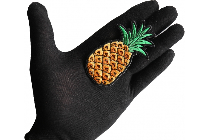 Pineapple Patch shown on hand for size comparison