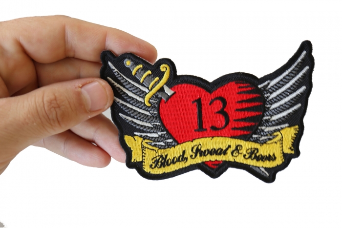 Rockabilly Tattoo heart Iron on Patch shown on hand for size comparison