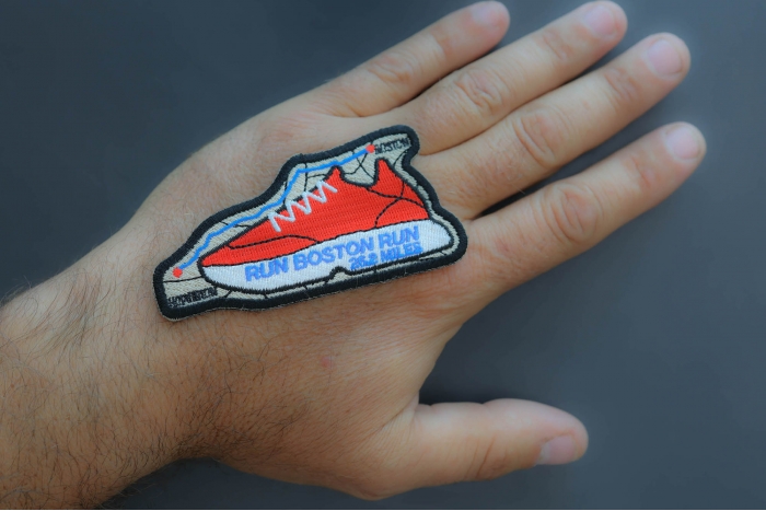 Run Boston Run Patch shown on hand for size comparison