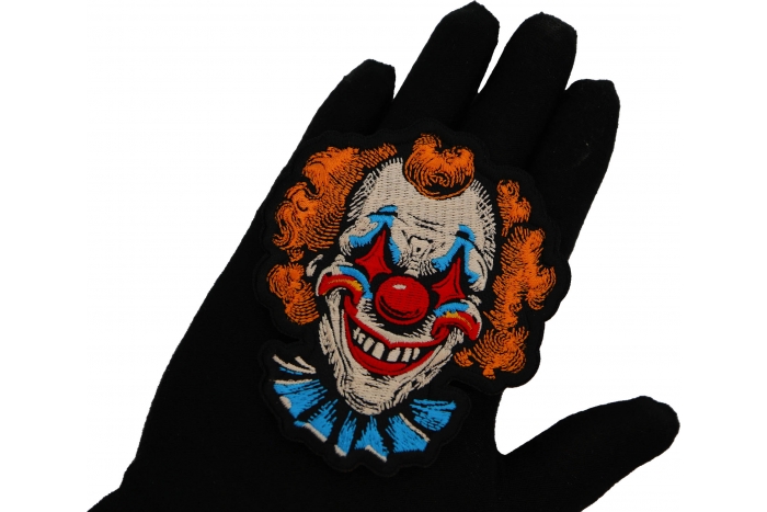 Scary Clown Patch shown on hand for size comparison