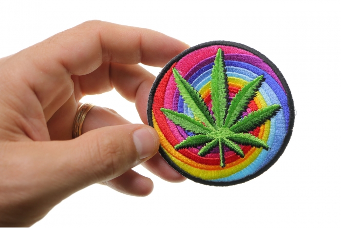 Sweet Leaf Marijuana Novelty Iron on Patch shown on hand for size comparison