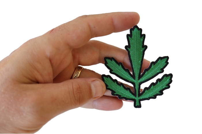 Symmetric Leaves Iron on Patch shown on hand for size comparison