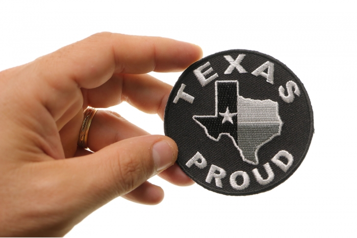 Texas Proud Patch shown on hand for size comparison