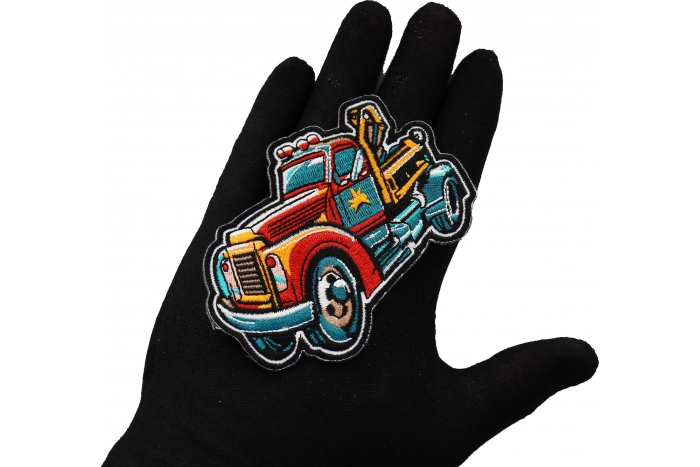 Tow Truck Patch shown on hand for size comparison