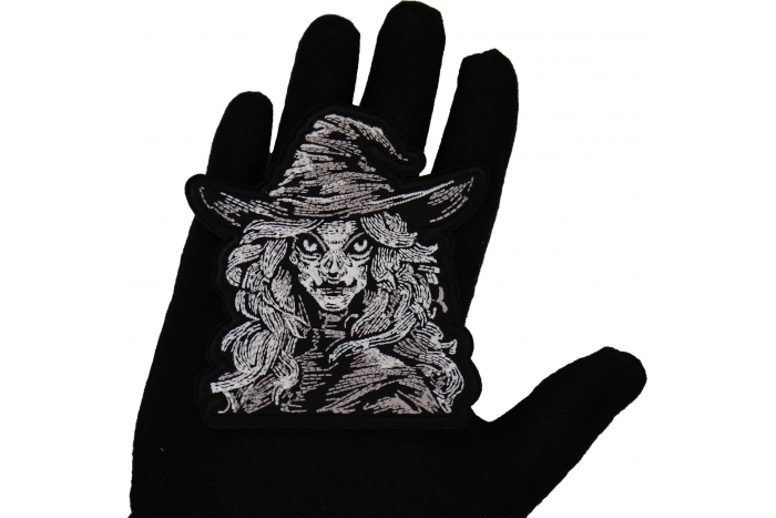 Wicked Witch Patch shown on hand for size comparison