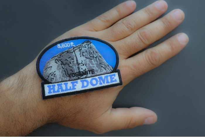 Yosemite Half Dome Patch shown on hand for size comparison