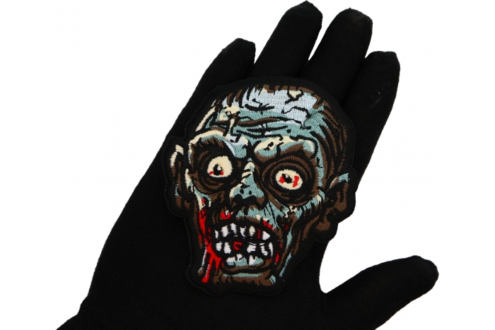 Zombie Head Patch shown on hand for size comparison