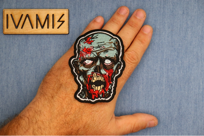 Zombie Patch shown on hand for size comparison