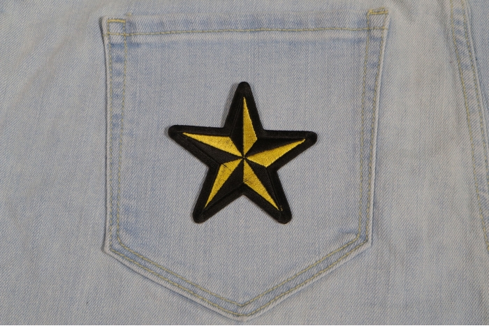 Black and Yellow Star Patch shown on jeans