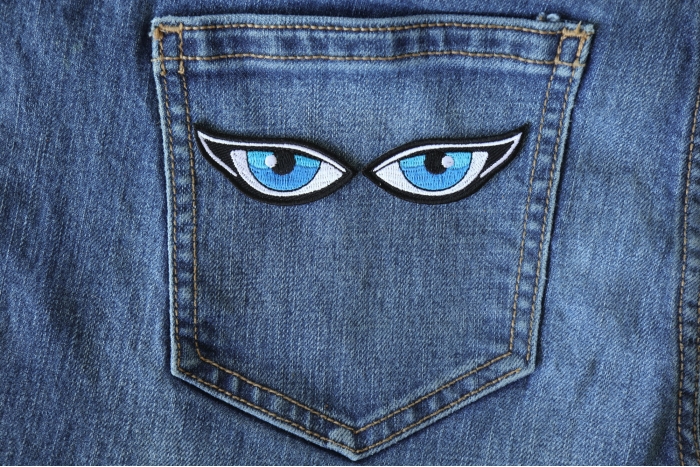 Iron on Blue Eye Patches shown on jeans
