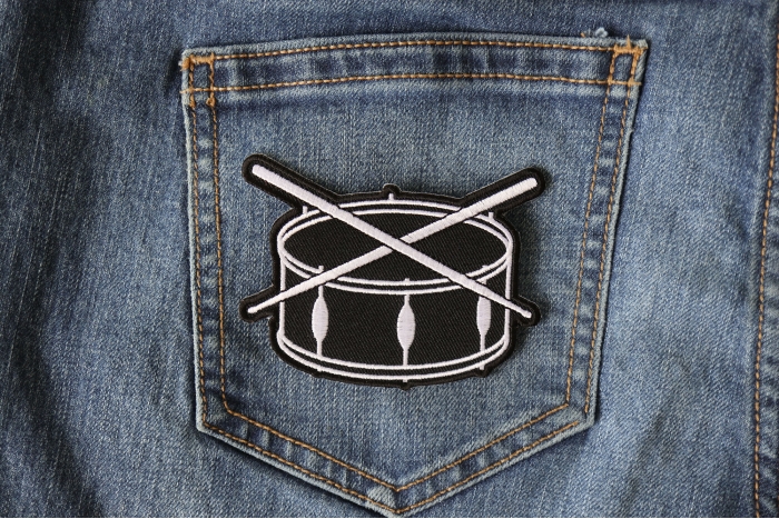 Drum and Sticks Music Band Iron on Novelty Patch shown on jeans