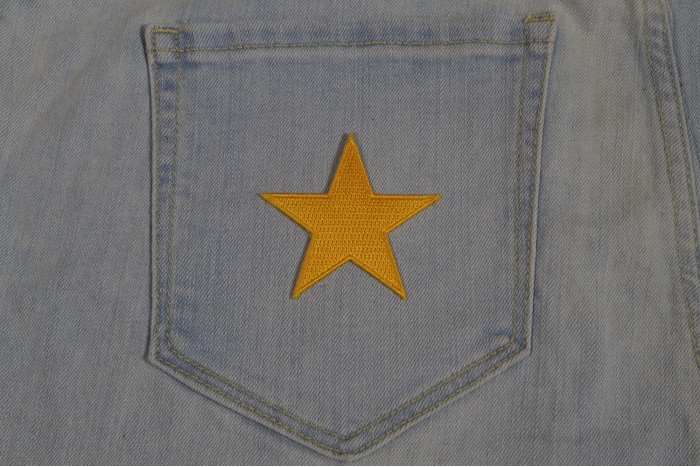Gold Star Patch shown on jeans