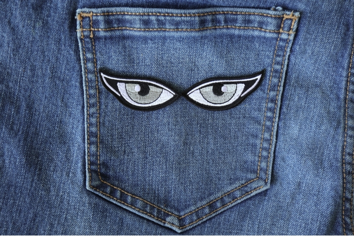 Gray Eyes Patch shown on jeans