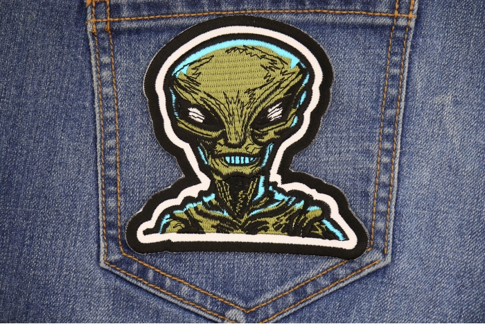 Green Alien Patch shown on jeans