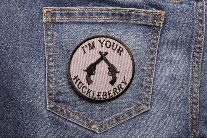 I'm Your Huckleberry Pistols Iron on Novelty Patch shown on jeans