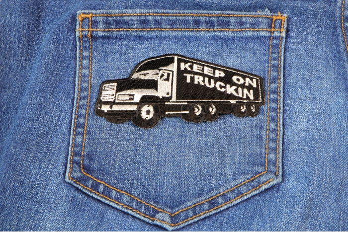 Keep On Trucking Iron on Novelty Patch shown on jeans