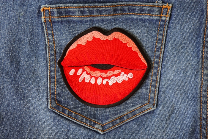 Lips Blowing a Kiss Iron on Patch shown on jeans