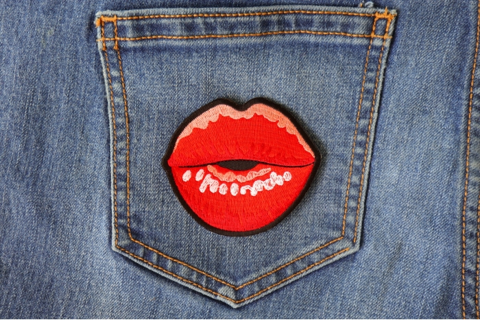 Kissing Lips Small Iron on Novelty Patch shown on jeans
