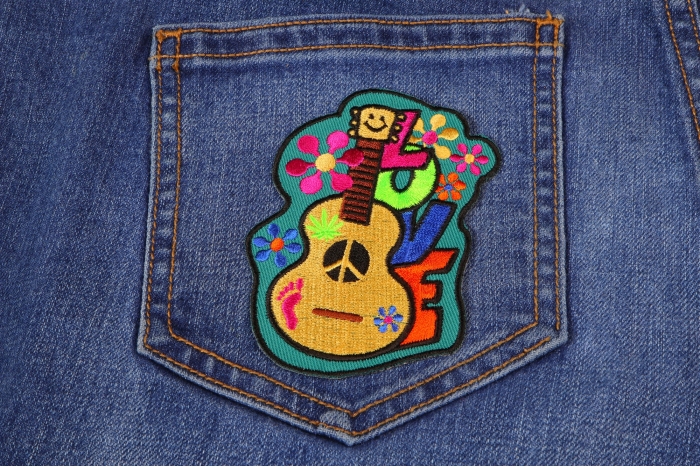 Love Guitar Cute Novelty Iron on Patch shown on jeans
