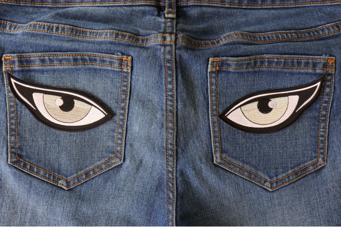 Medium Silver Eyes Iron on Patch shown on jeans