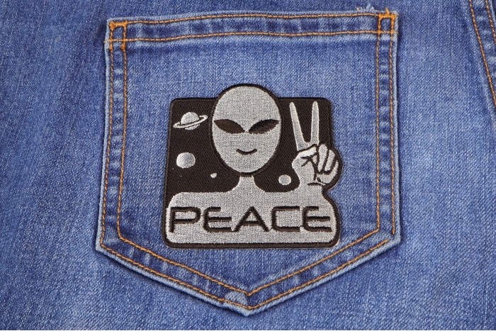 Peace Alien Fun Novelty Iron on Patch shown on jeans