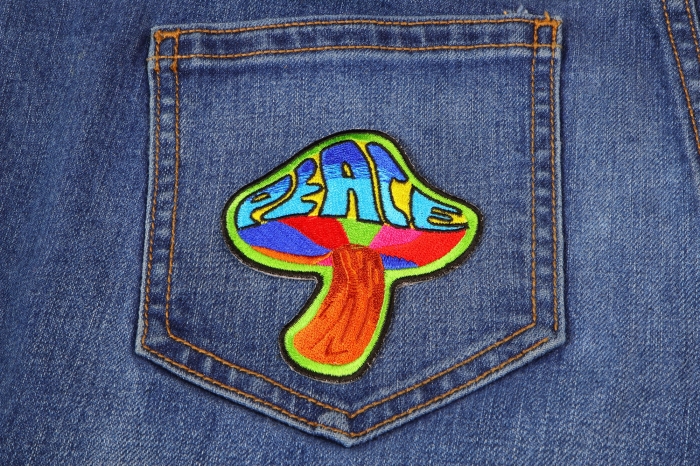 Peace Mushroom Novelty Iron on Patch Psychedelic Hippie shown on jeans