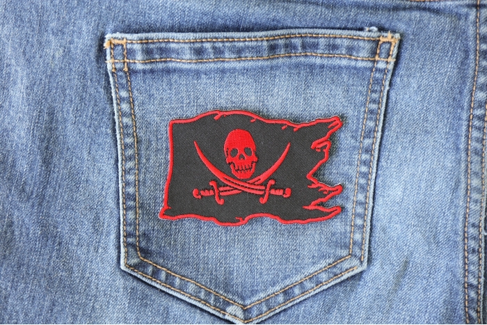 Pirate Flag Skull and Crossed Swords Patch shown on jeans