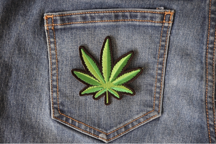 Pot Leaf Novelty Iron on Patch shown on jeans
