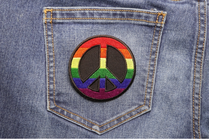 Rainbow Peace Novelty Iron on Patch shown on jeans