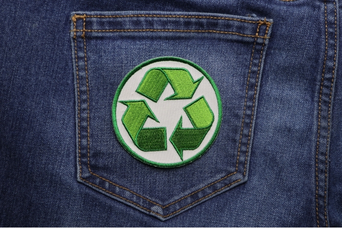 Recycle Sign Novelty Iron on Patch shown on jeans