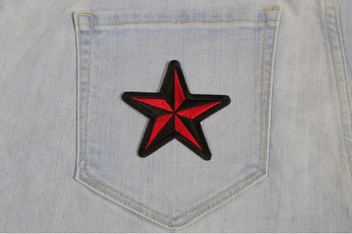 Red Black Star Novelty Iron on Patch shown on jeans
