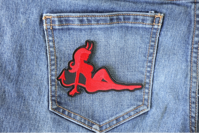 Red Devil Girl Novelty Iron on Patch shown on jeans