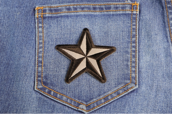 Reflective Nautical Star Novelty Iron on Patch shown on jeans