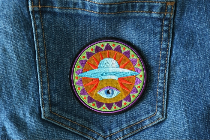 Spiritual Eye UFO Novelty Iron on Patch shown on jeans
