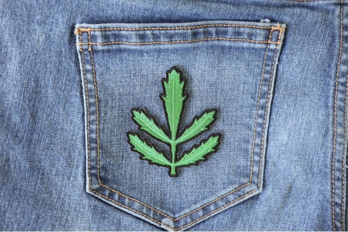 Symmetric Leaves Iron on Patch shown on jeans
