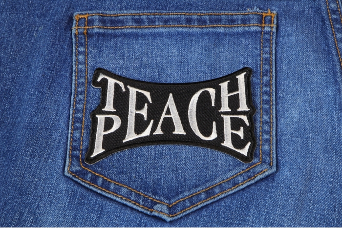 Teach Peace Novelty Iron on Patch shown on jeans
