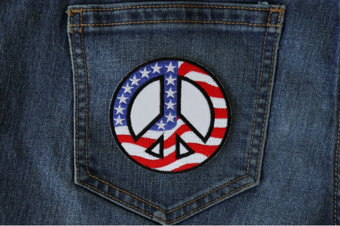 US Flag Peace Sign Novelty Iron on Patch shown on jeans