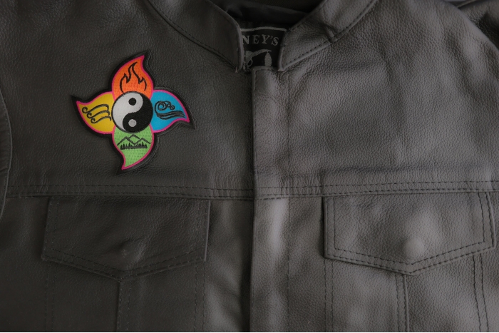 Four Elements Patch shown on leather vest