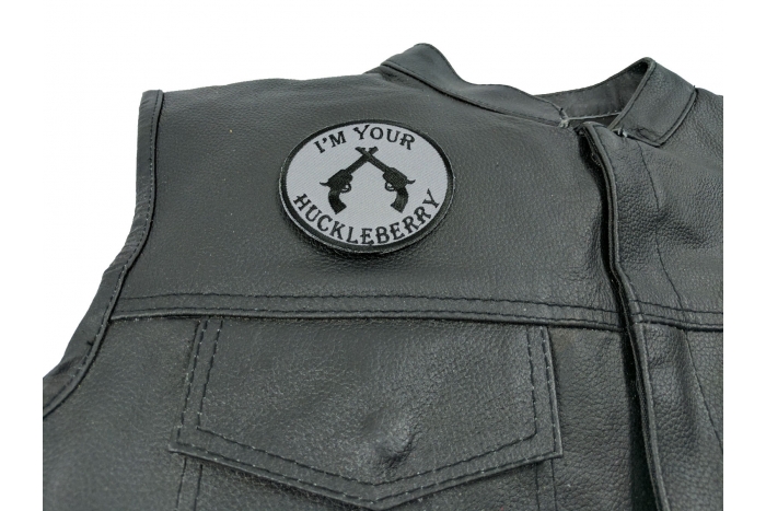 I'm Your Huckleberry Pistols Patch - 3x3 inch. Embroidered Iron on Patch shown on leather vest