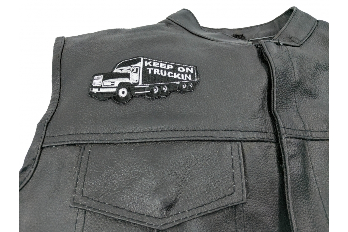 Keep On Trucking Patch - 4x2 inch. Embroidered Iron on Patch shown on leather vest