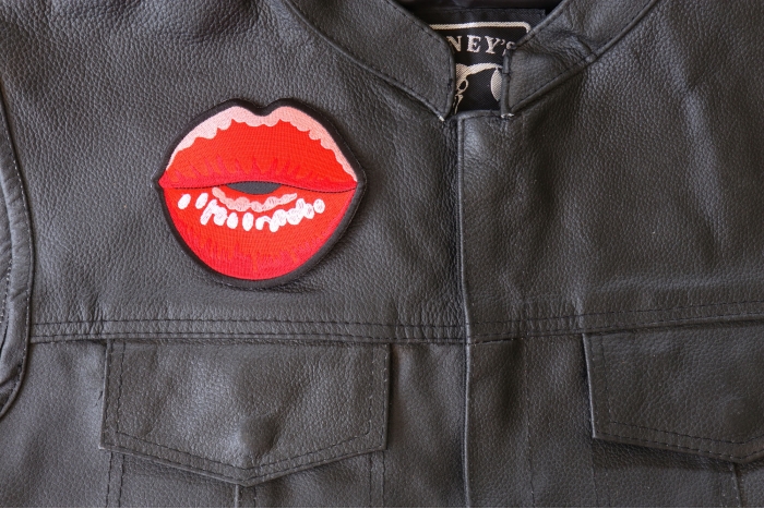 Kissing Lips Patch - 4x3.6 inch - Embroidered Iron on Patch shown on leather vest