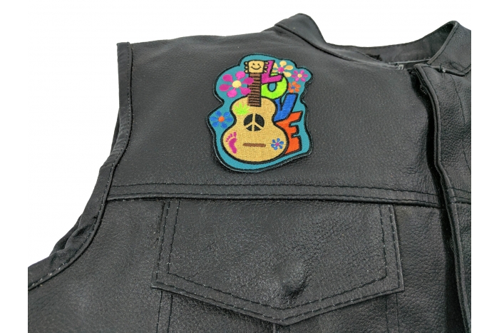 Love Guitar Cute Patch - 2.7x3.8 inch. Embroidered Iron on Patch shown on leather vest